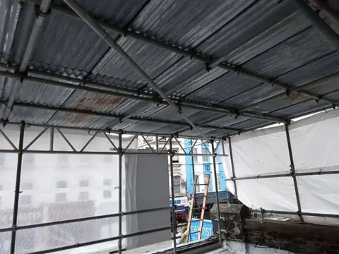 Insulated flat-roof build-up under construction at the Camden dental practice