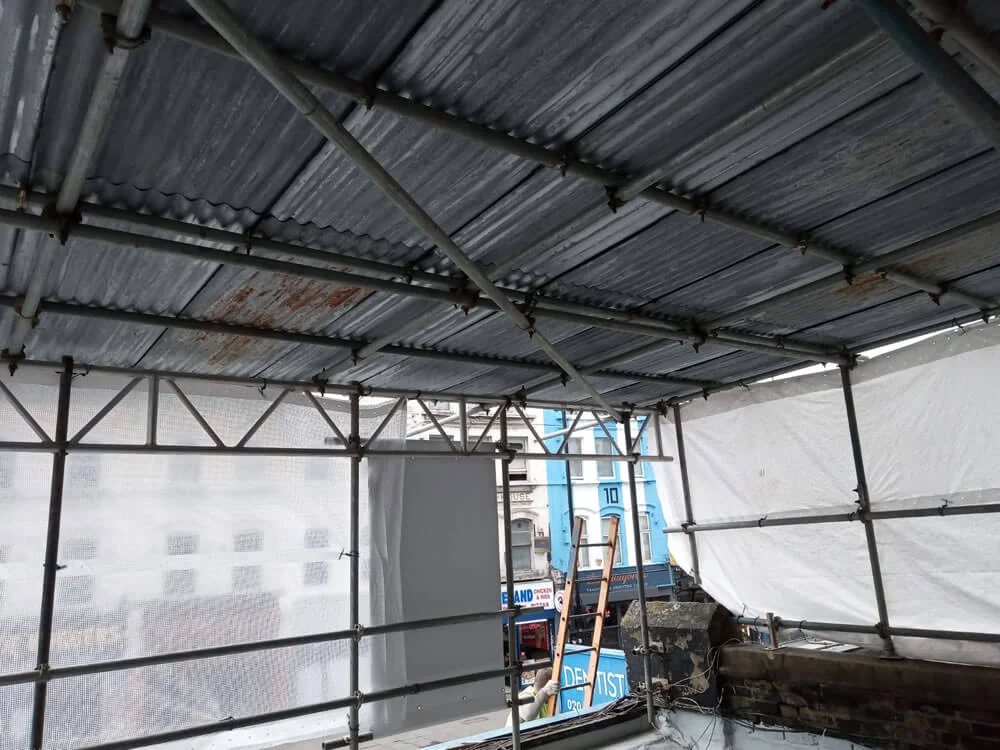 Insulated flat-roof build-up under construction at the Camden dental practice