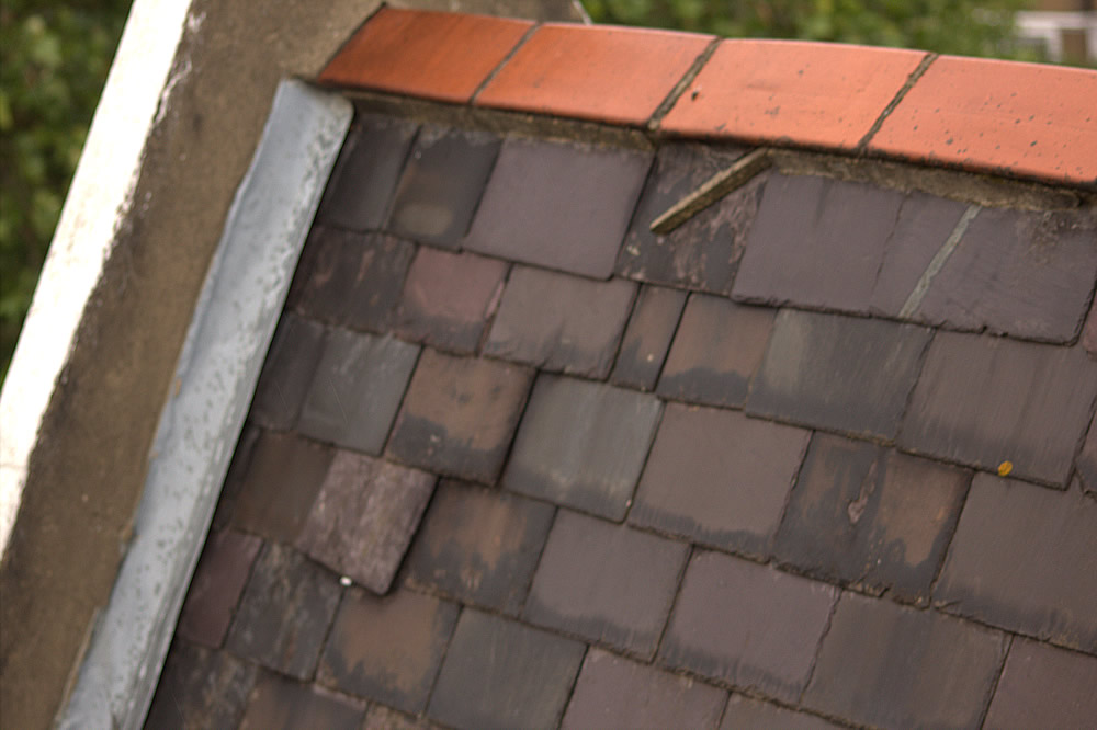 Existing man-made roof slates being removed at Lonsdale Square