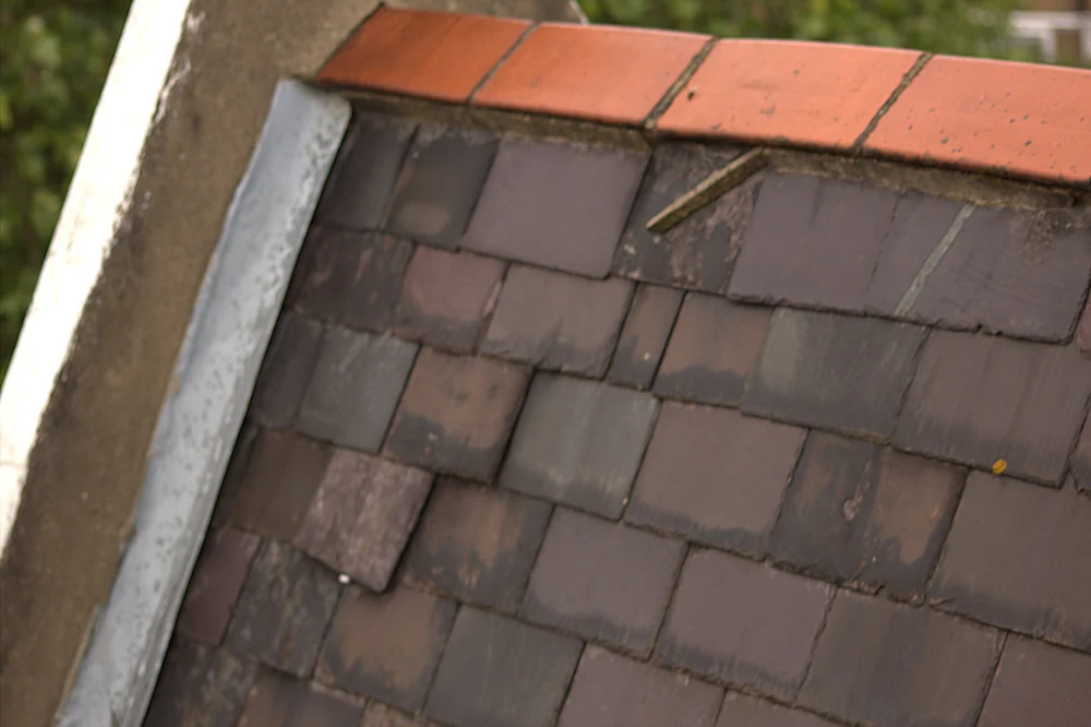 Existing man-made roof slates being removed at Lonsdale Square