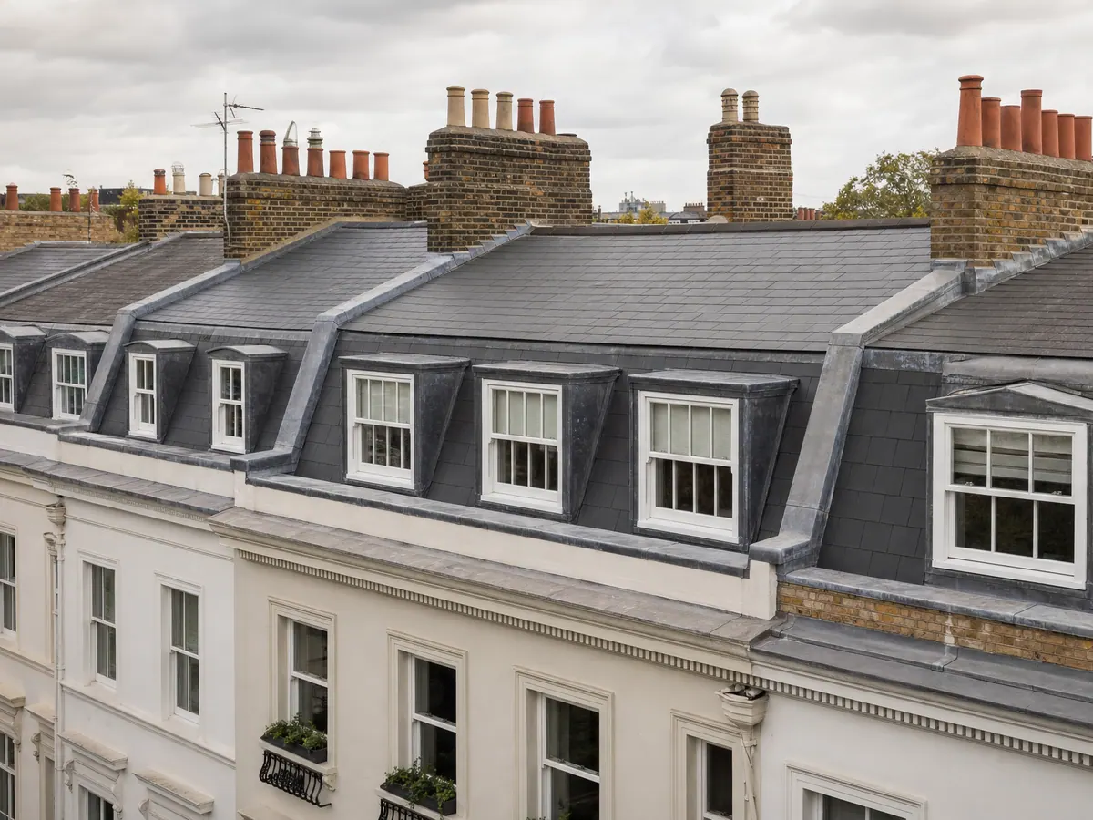 Slate roofs and brick chimneys on a period terrace