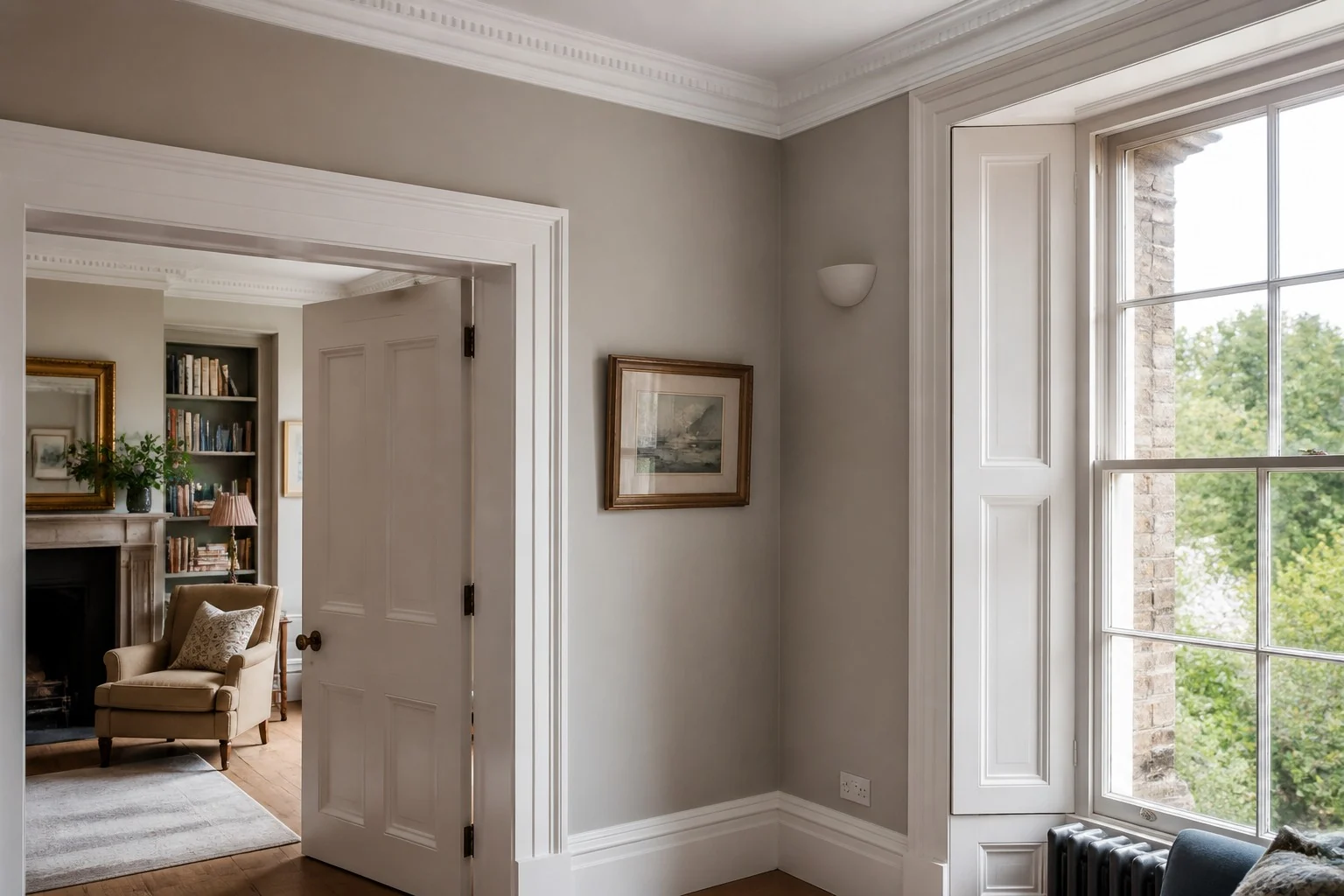 Crisp plaster and paint finish around cornice, architrave and window reveal