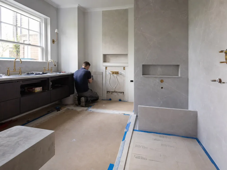 Bathroom plumbing installation with exposed fittings
