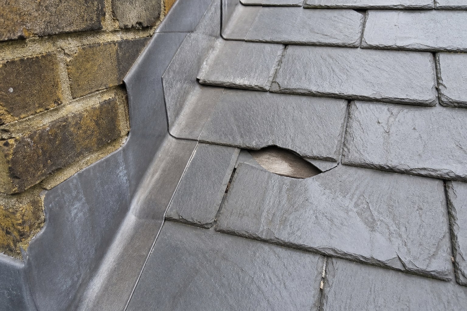 Illustrative local slate and flashing defect for focused repair assessment