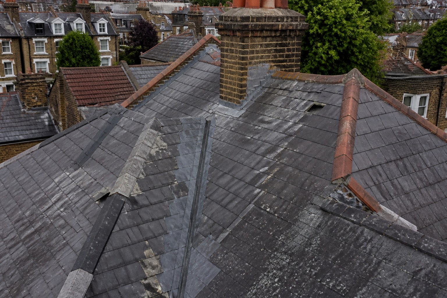 Illustrative wider roof deterioration around valleys and earlier repairs