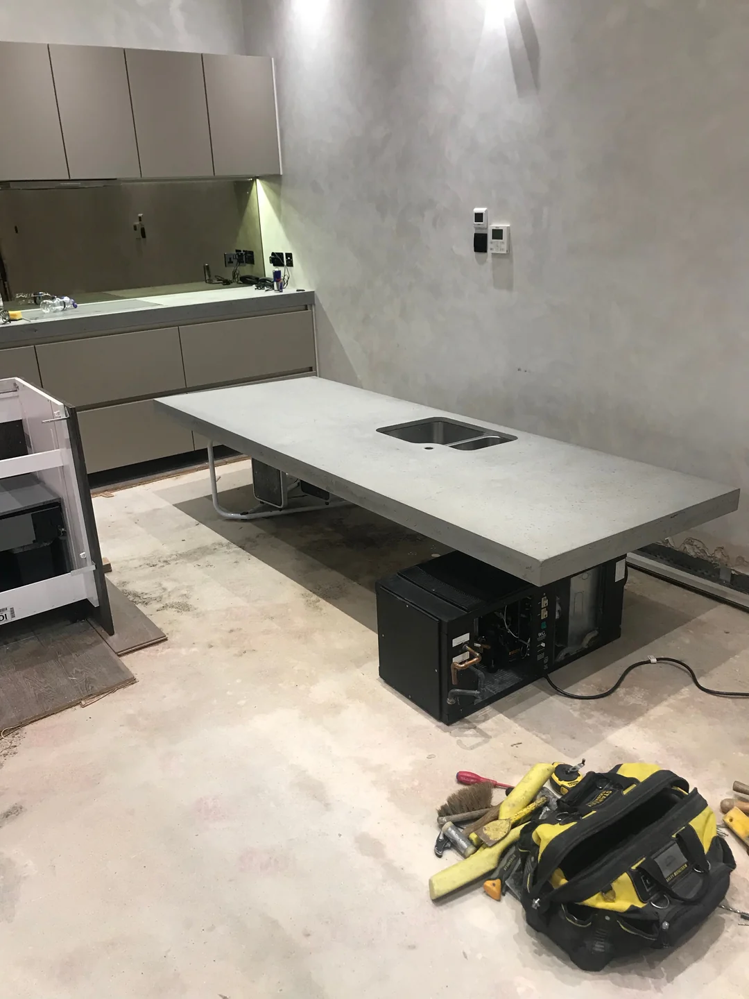 Basement floor and kitchen area during reinstatement