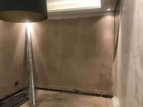 Basement wall opened to expose the waterproofing system