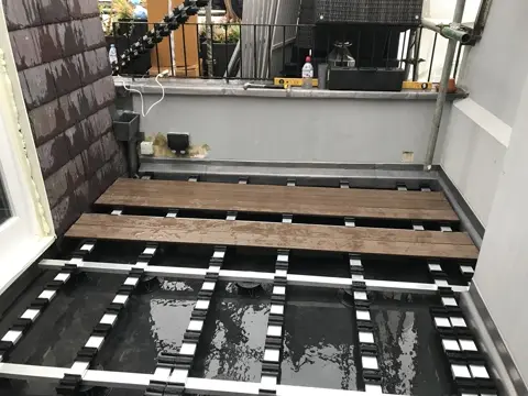 Terrace deck supports installed above the waterproofed roof
