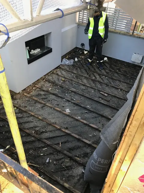 Roof terrace stripped back during the defect investigation