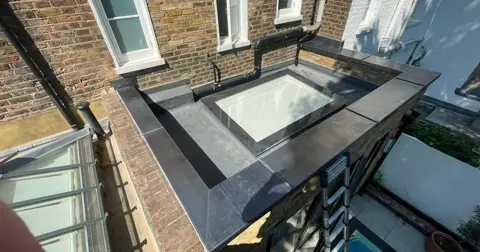 Completed lead capping across the Kensington parapet wall