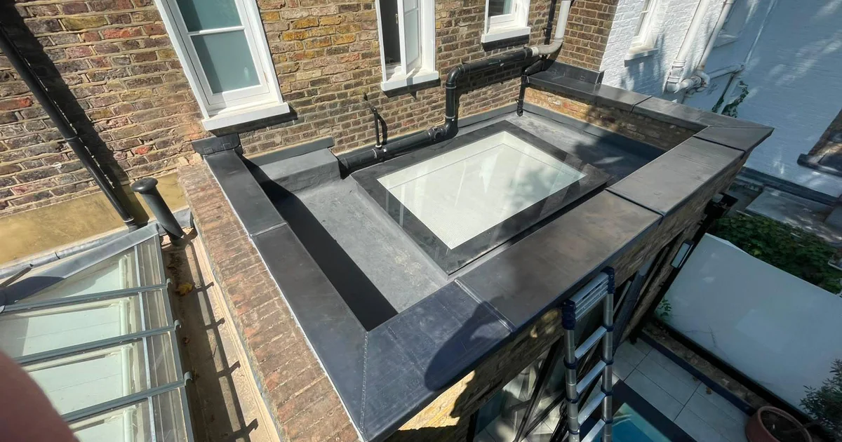 Completed lead capping across the Kensington parapet wall