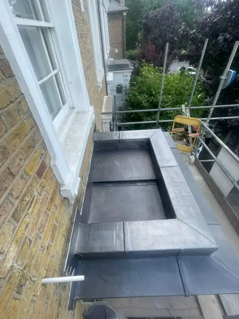 Completed lead capping across a parapet bay