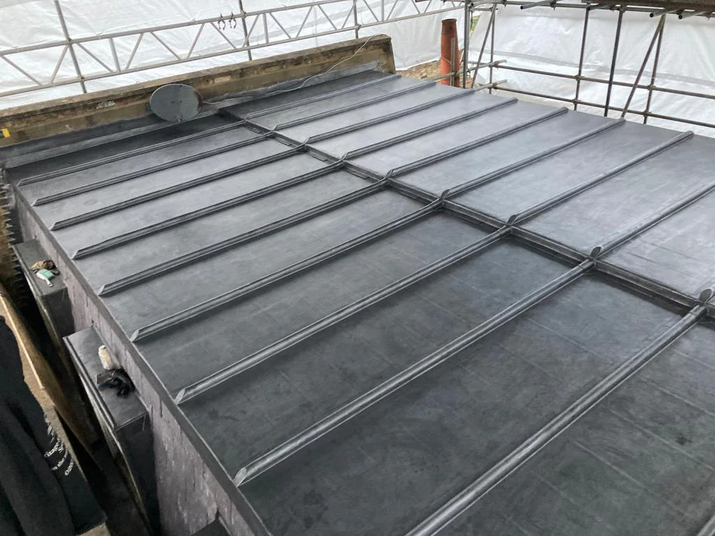 Wide view of the completed lead roof to the restored turret