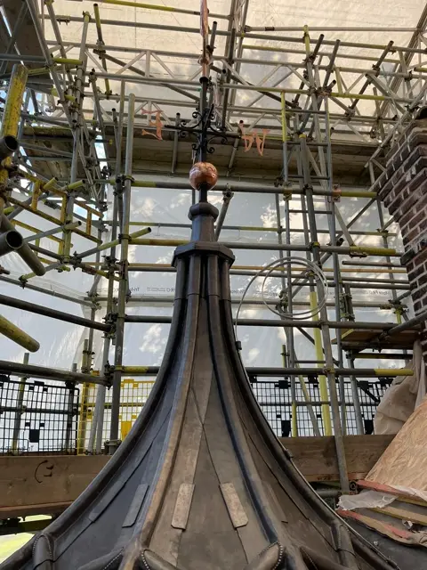 Full-height view of the restored roof turret