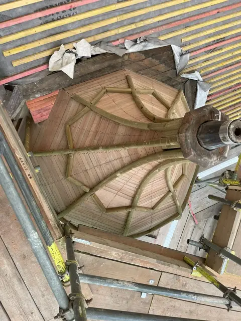 Curved timber framing prepared for the turret covering