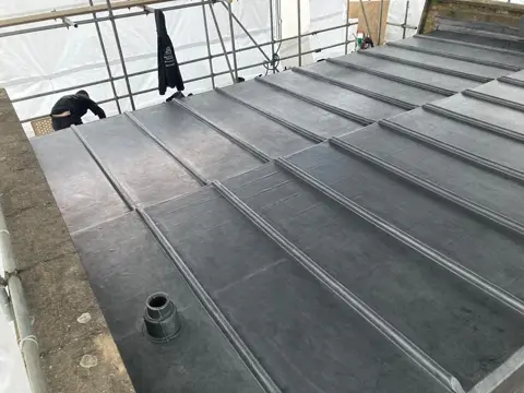 Lead bay being installed over the prepared turret structure