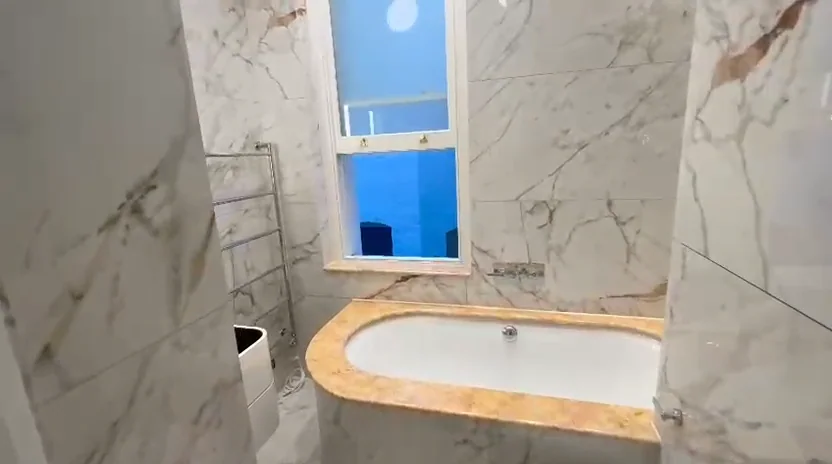 Finished bathroom with fitted bath at Nevern Mansions