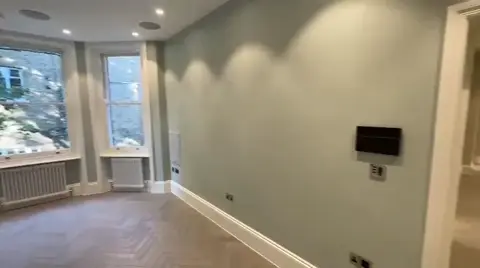 Living room media controls integrated into the refurbishment