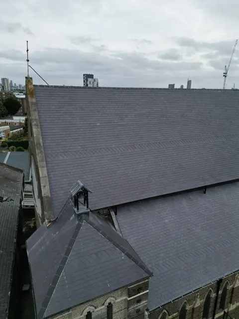 Completed slate covering across the church roof pitch