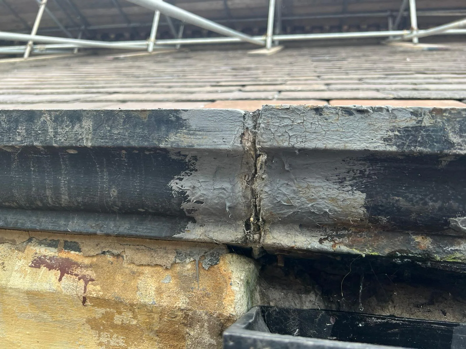 Water ingress at the church gutter and slate junction