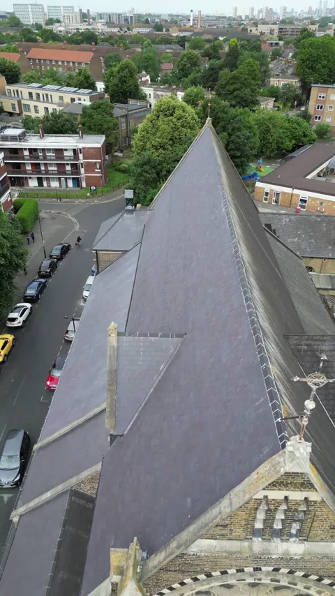 Play wider aerial view of the church and roof