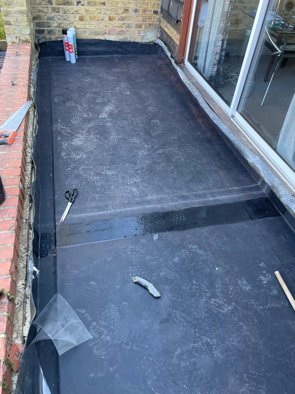Close view of the completed EPDM porch roof detail