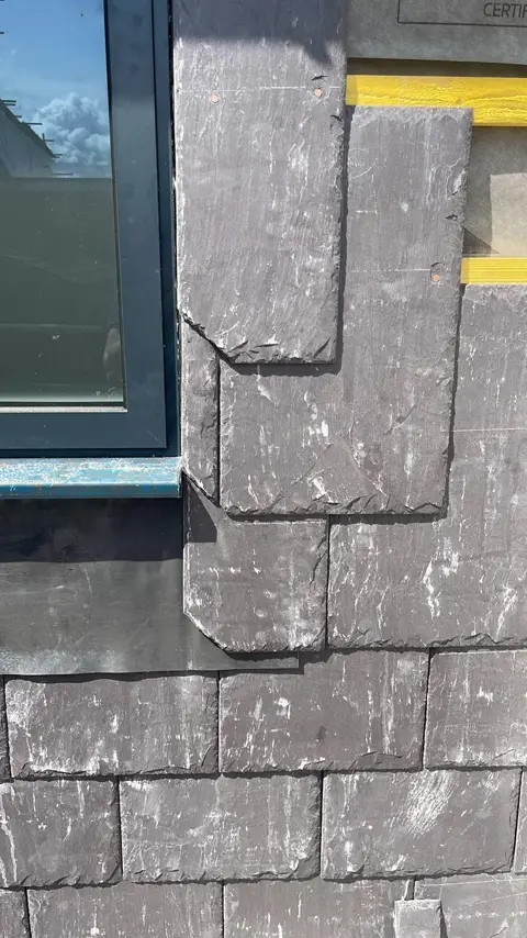 Close view of vertical slate detailing on the porch