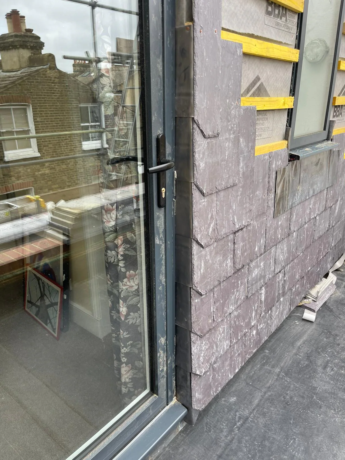 Completed vertical slate covering to the SW8 porch